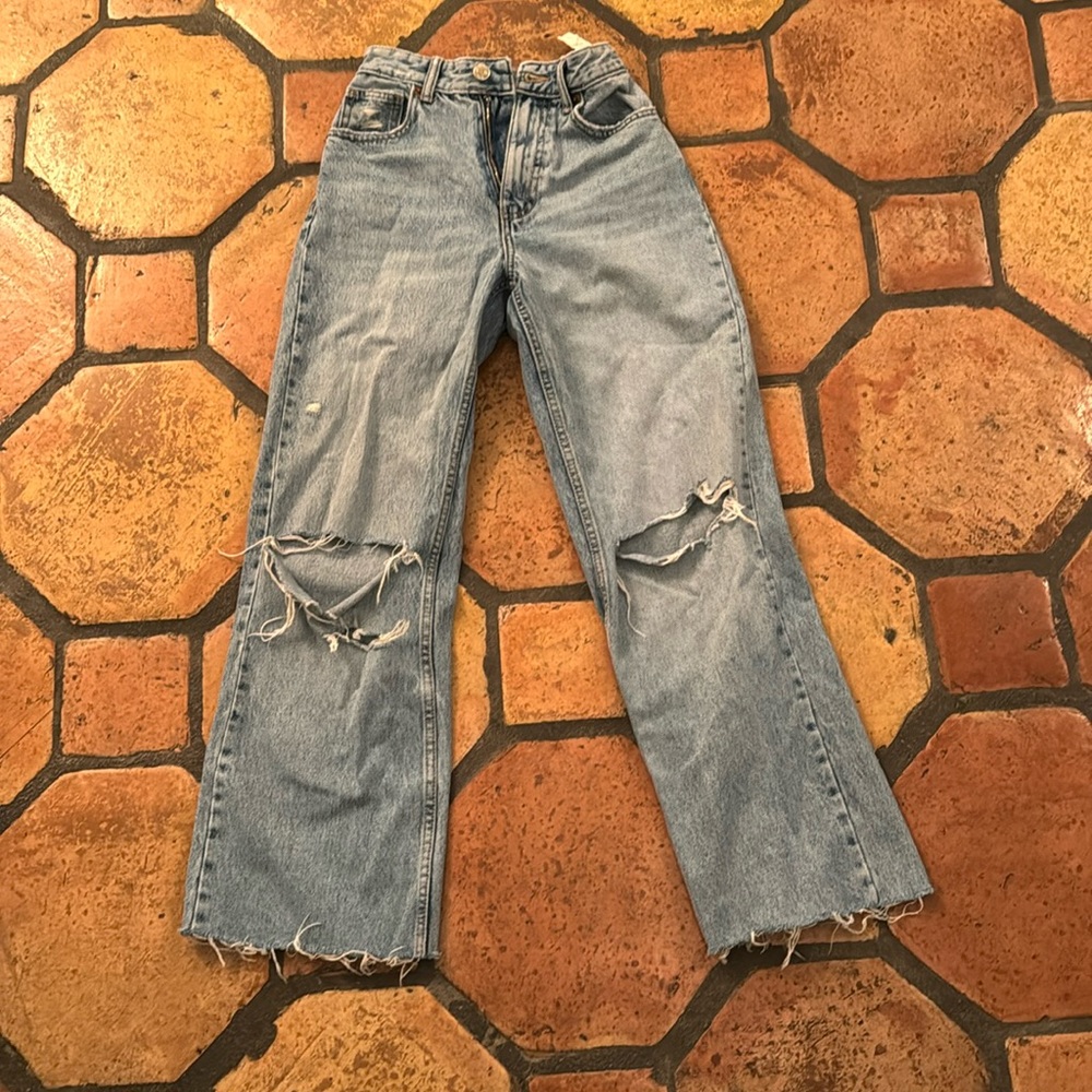 Blue ripped high rise/ wide legged/ ripped jeans